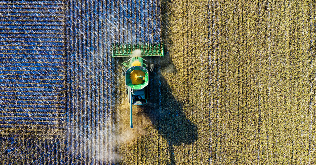 aerial-shot-of-green-milling-tractor-1595108